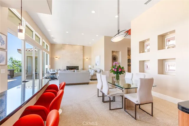 a living room with furniture a rug and a chandelier