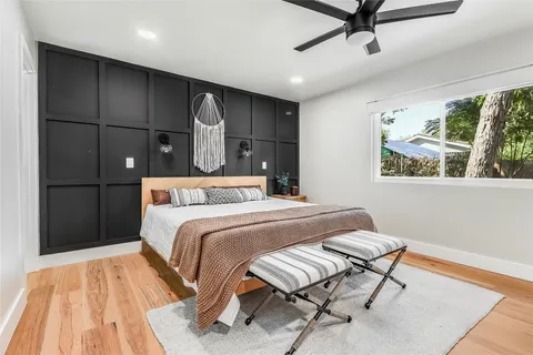 a bedroom with a bed and a dresser