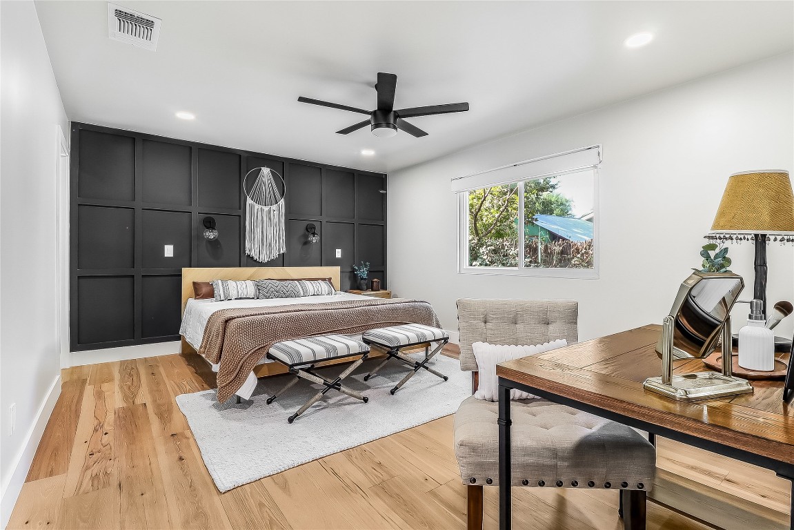 7717 Croftwood Drive Austin, TX 78749 - Photo 20 of 40 a bedroom with a bed and a table