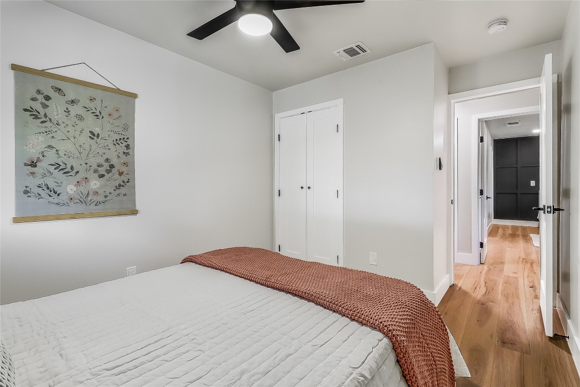 7717 Croftwood Drive Austin, TX 78749 - Photo 22 of 40 a bedroom with a bed and a painting on the wall