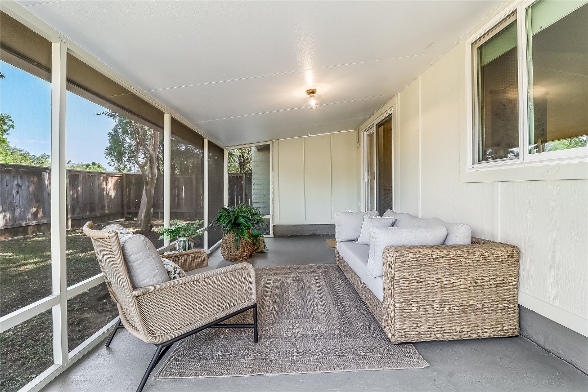 7717 Croftwood Drive Austin, TX 78749 - Photo 26 of 40 a living room with furniture and a large window