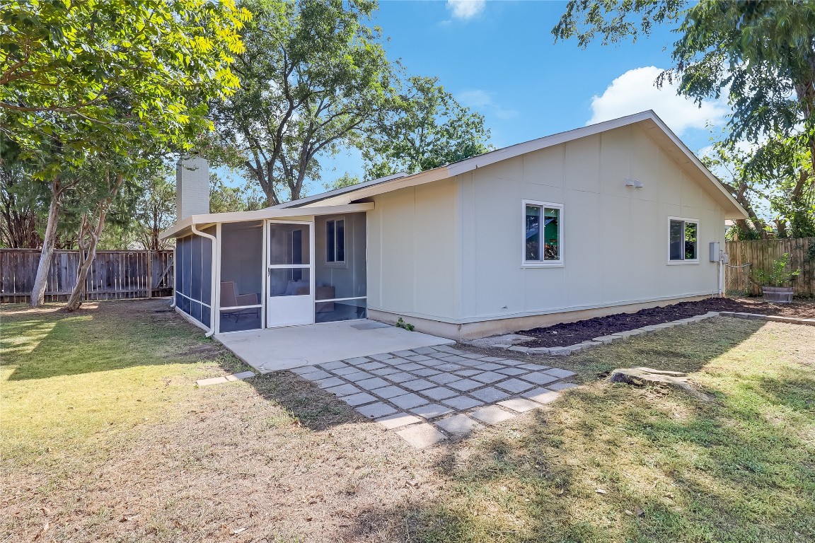 7717 Croftwood Drive Austin, TX 78749 - Photo 27 of 40 a view of a backyard with a large tree