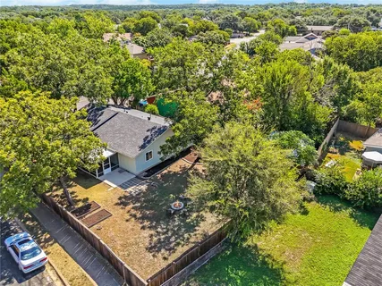 an aerial view of house with yard