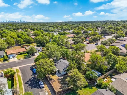 a view of a house with a tree