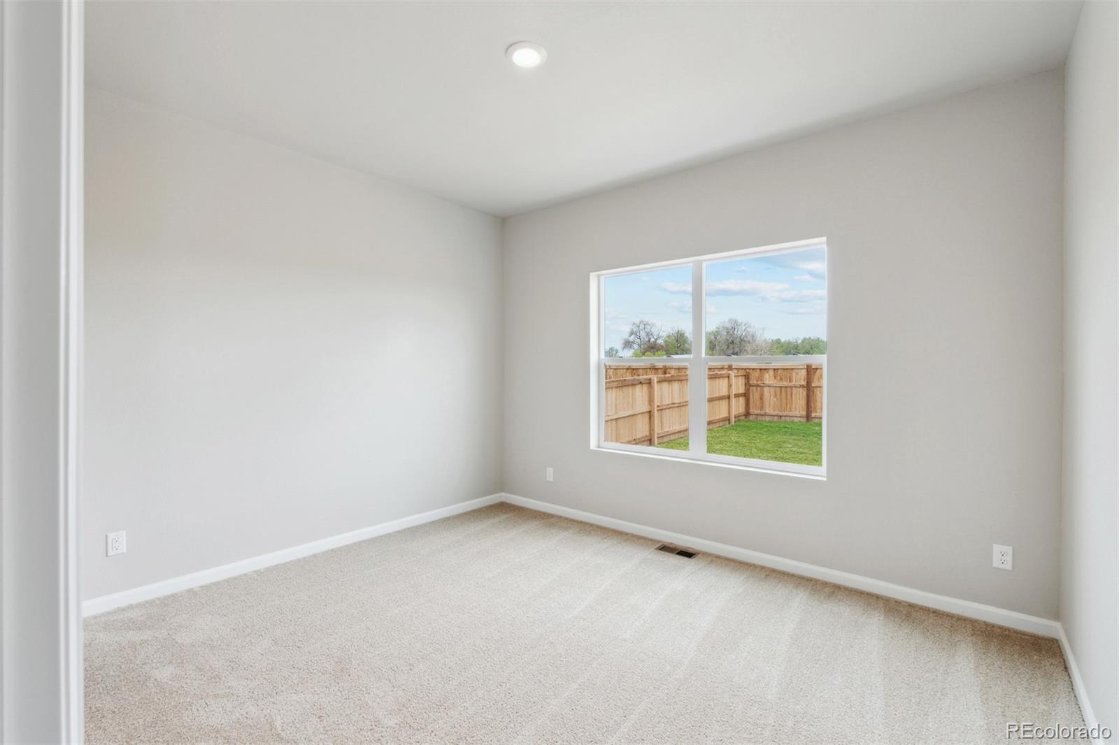 977 Ouzel Falls Road Severance, CO 80550 - Photo 11 of 19 an empty room with a window