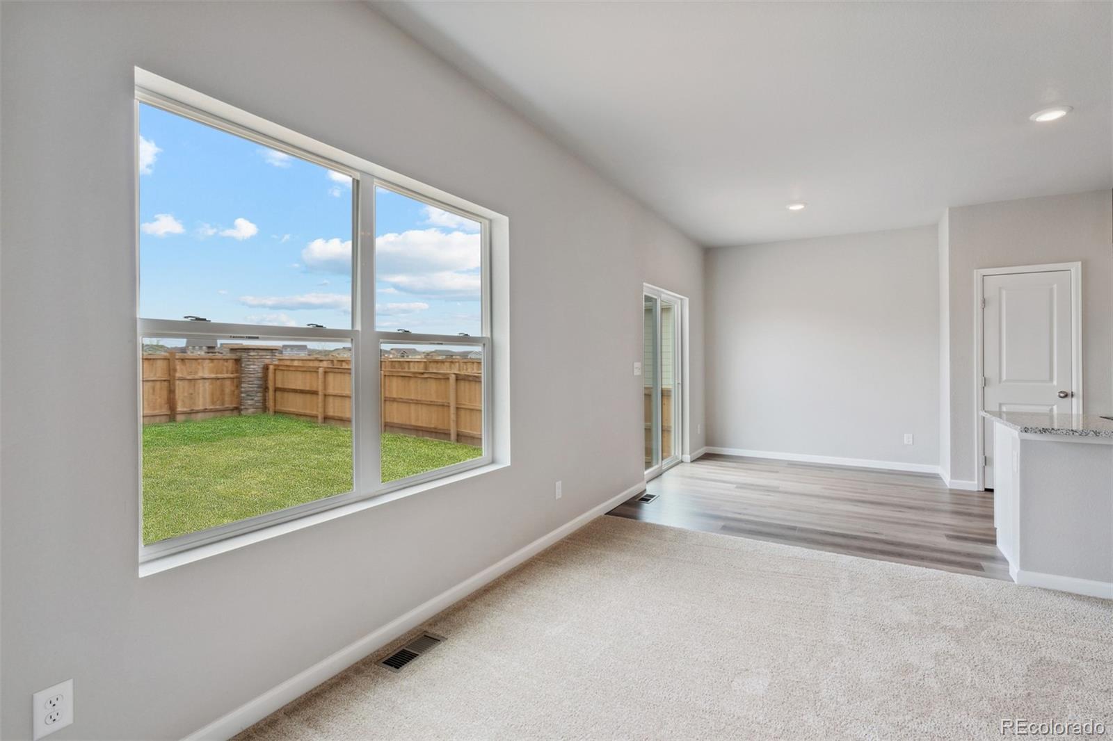 977 Ouzel Falls Road Severance, CO 80550 - Photo 9 of 19 a view of an empty room with a window