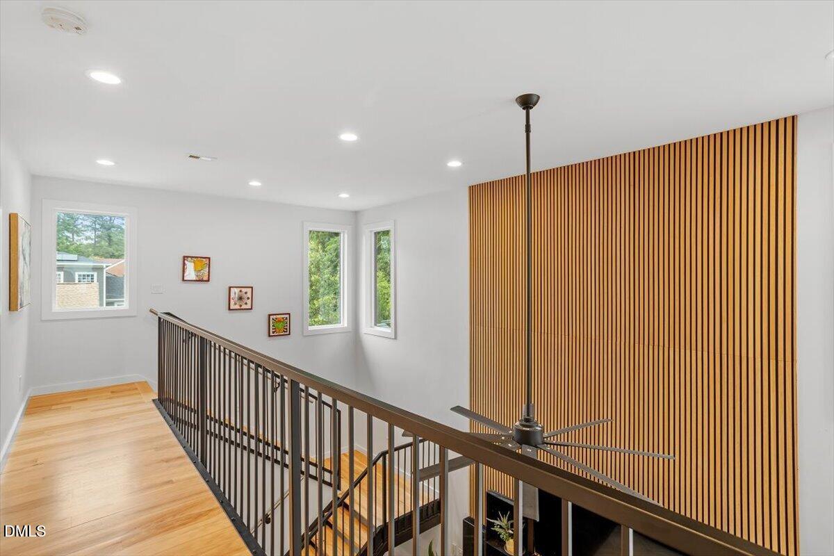 1410 Duplin Road Raleigh, NC 27607 - Photo 33 of 54 a view of a hallway with wooden floor and windows