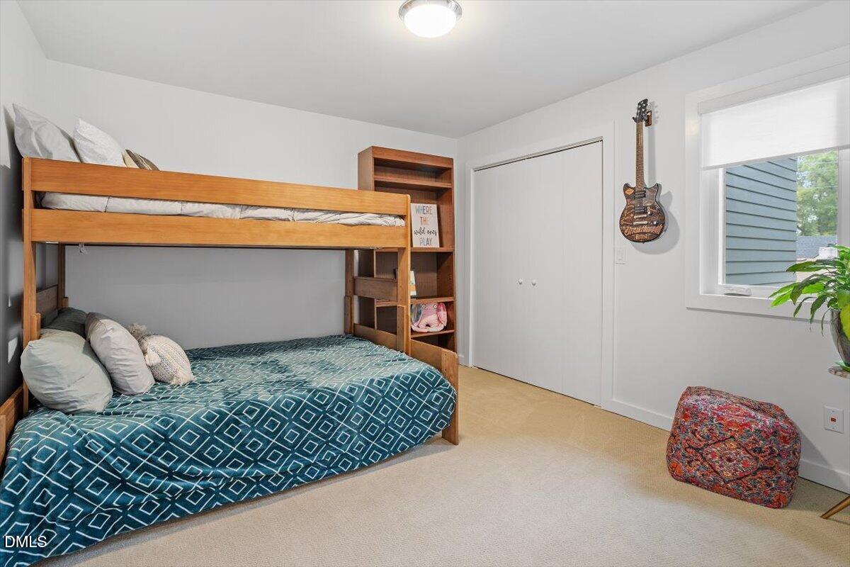 1410 Duplin Road Raleigh, NC 27607 - Photo 35 of 54 a bedroom with a bed and a window