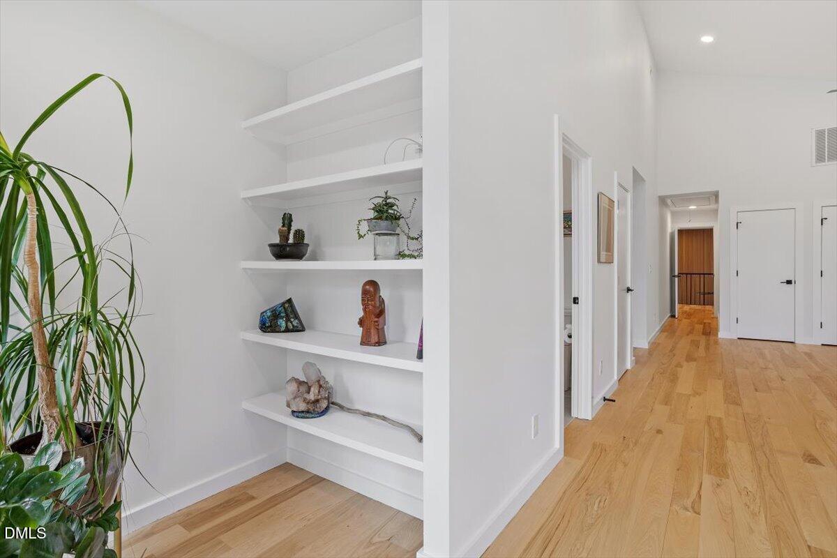 1410 Duplin Road Raleigh, NC 27607 - Photo 41 of 54 a view of entryway and hall with wooden floor