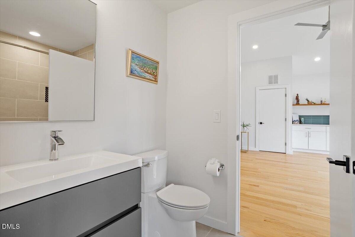 1410 Duplin Road Raleigh, NC 27607 - Photo 47 of 54 a bathroom with a sink a toilet and shower
