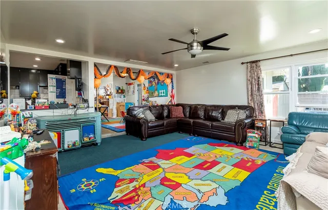 a bedroom with a bed dresser and a window