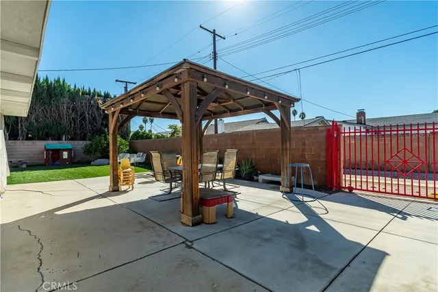 a front view of a house with a garden and yard