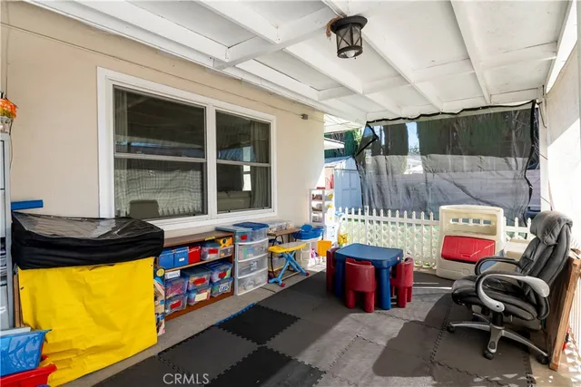 a kitchen with stainless steel appliances granite countertop a sink a stove a refrigerator and cabinets