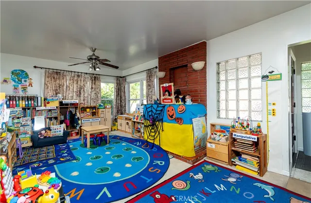 a very nice looking dining room with lots of furniture and toys