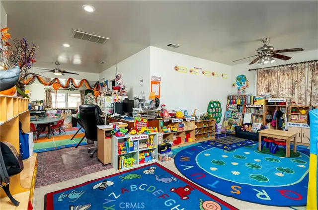 a room with lots of furniture and toys