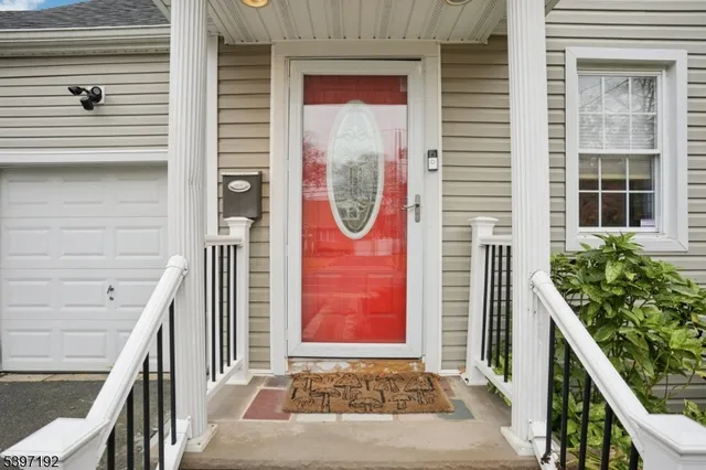 a front view of a house with lots of green space