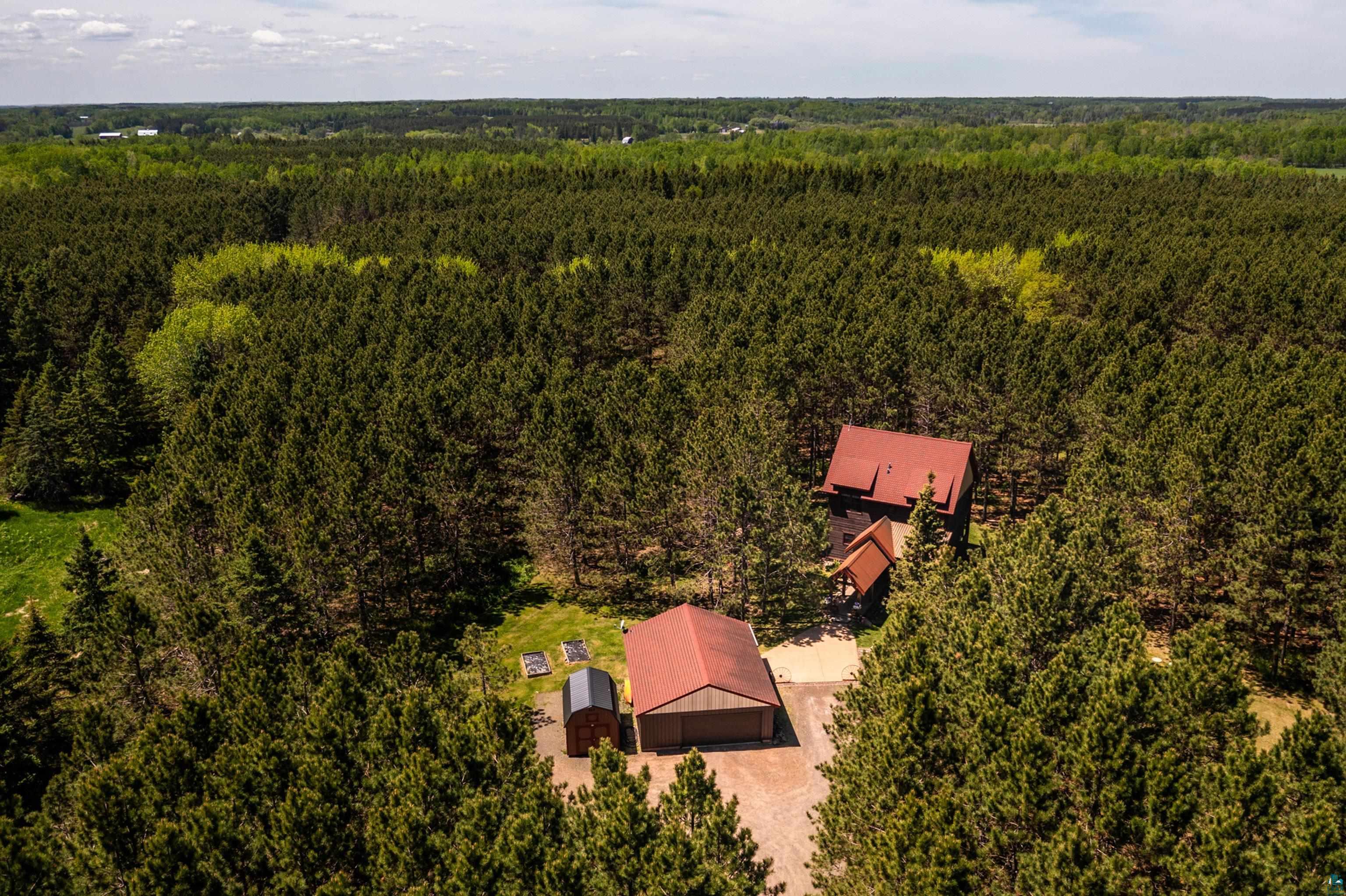 75 East Stark Road Esko, MN 55733 - Photo 2 of 87 Aerial perspective showcasing a property surrounded by dense evergreen and deciduous trees