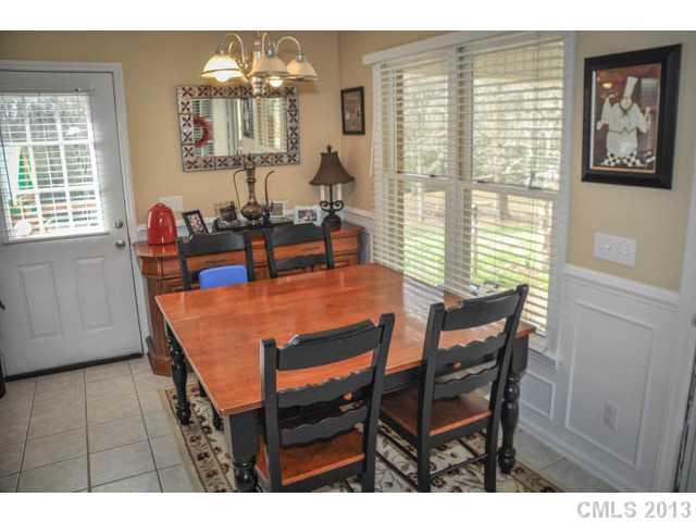 4915 Griffith Road Monroe, NC 28112 - Photo 12 of 16 a dining room with furniture and window