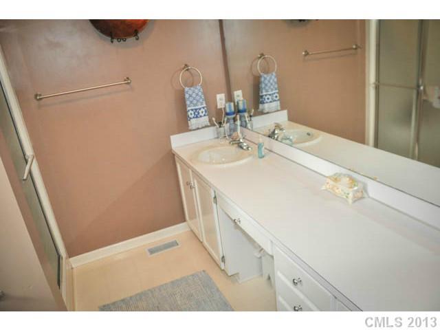 4915 Griffith Road Monroe, NC 28112 - Photo 16 of 16 a bathroom with a sink and a mirror