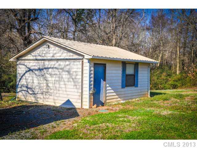 4915 Griffith Road Monroe, NC 28112 - Photo 3 of 16 a house view with a garden space