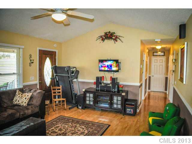 4915 Griffith Road Monroe, NC 28112 - Photo 9 of 16 a living room with furniture and a flat screen tv