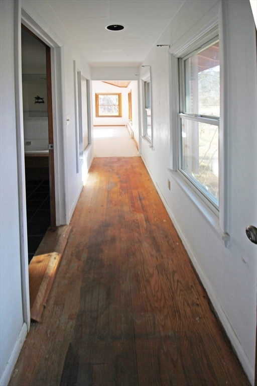 128 Amherst Road Pelham, MA 01002 - Photo 12 of 31 wooden floor in an empty room with a window