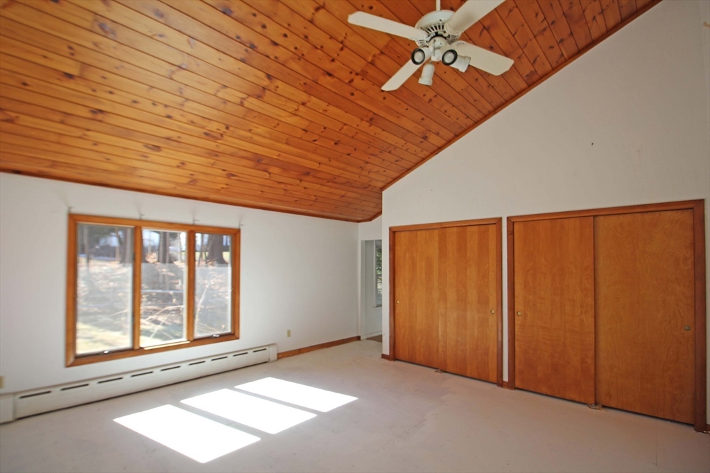 128 Amherst Road Pelham, MA 01002 - Photo 13 of 31 an empty room with windows