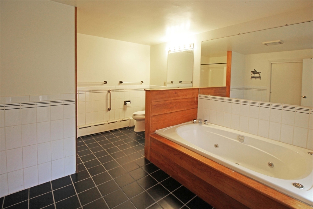 128 Amherst Road Pelham, MA 01002 - Photo 14 of 31 a bathroom with a bathtub and a shower