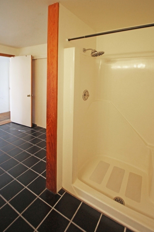 128 Amherst Road Pelham, MA 01002 - Photo 15 of 31 a bathroom with a glass shower door