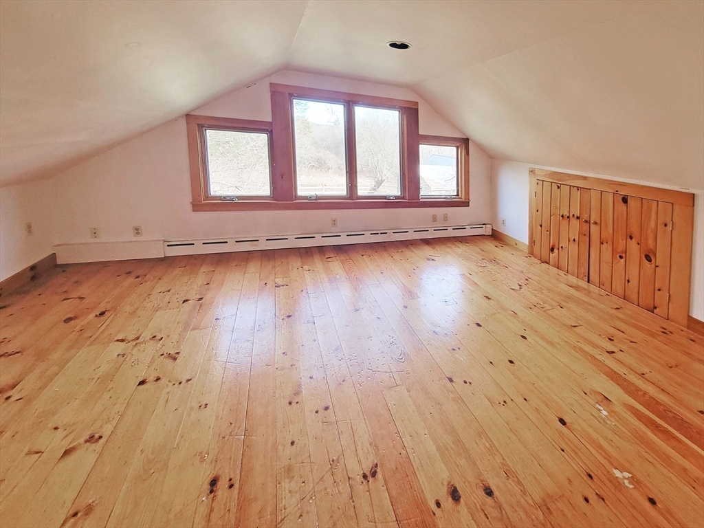 128 Amherst Road Pelham, MA 01002 - Photo 23 of 31 an empty room with wooden floor and windows