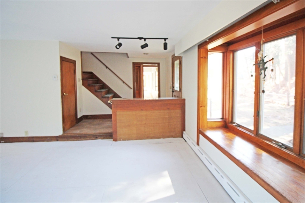 128 Amherst Road Pelham, MA 01002 - Photo 5 of 31 an entryway with staircase