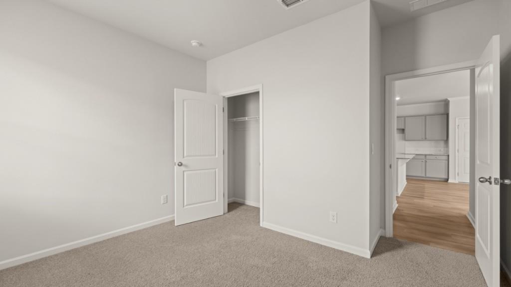 92 Cyrilla Walk Dallas, GA 30132 - Photo 12 of 35 an empty room with mirror in it