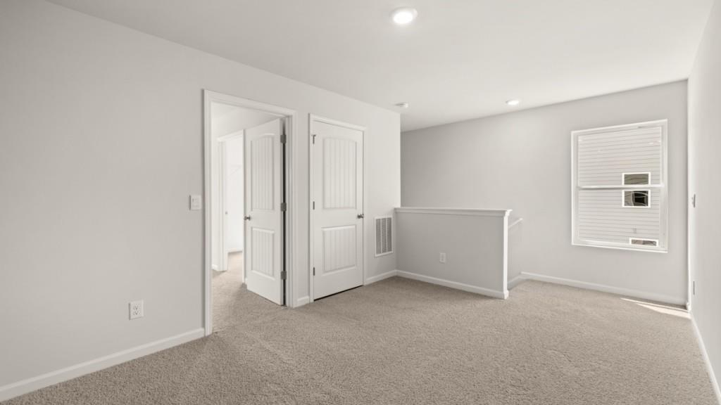 92 Cyrilla Walk Dallas, GA 30132 - Photo 14 of 35 an empty room with windows and closet