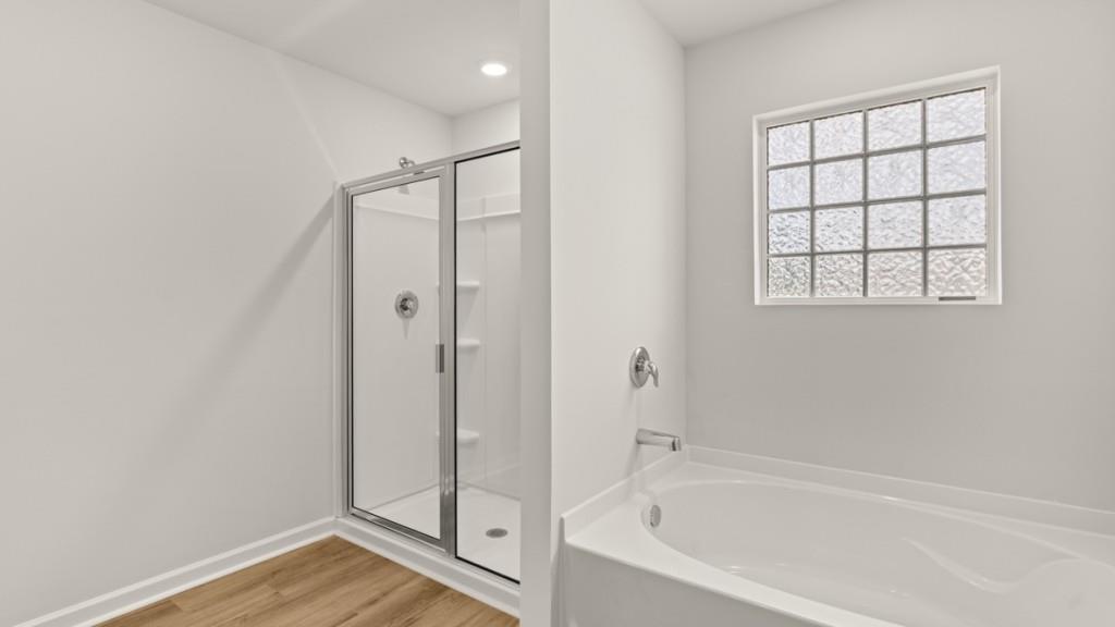 92 Cyrilla Walk Dallas, GA 30132 - Photo 19 of 35 a bathroom with a bathtub and a shower