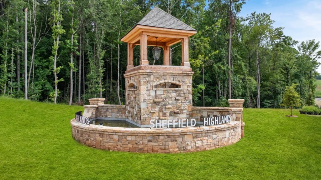 92 Cyrilla Walk Dallas, GA 30132 - Photo 29 of 35 a view of a house with a yard fire pit and a large tree