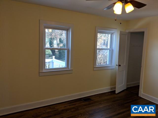212 Spicers Mill Road Orange, VA 22960 - Photo 11 of 38 a view of an empty room with wooden floor and a window