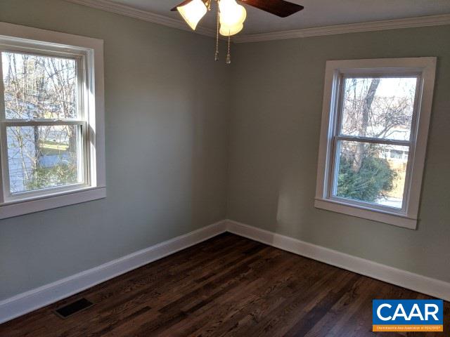 212 Spicers Mill Road Orange, VA 22960 - Photo 14 of 38 a view of an empty room with wooden floor and a window