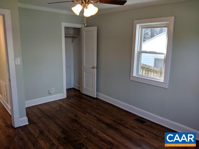 212 Spicers Mill Road Orange, VA 22960 - Photo 15 of 38 a view of an empty room with wooden floor and a window