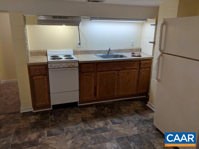 212 Spicers Mill Road Orange, VA 22960 - Photo 22 of 38 a room with stainless steel appliances granite countertop a sink stove and refrigerator