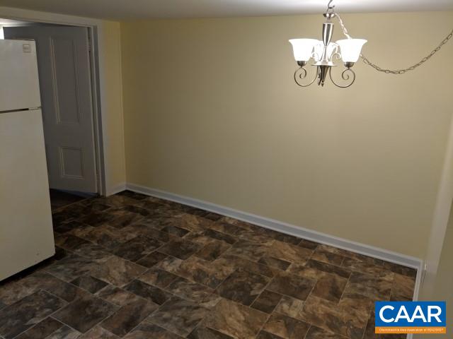 212 Spicers Mill Road Orange, VA 22960 - Photo 24 of 38 a view of a room with a hanging light and kitchen view