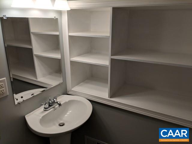 212 Spicers Mill Road Orange, VA 22960 - Photo 27 of 38 a bathroom with a sink and a mirror