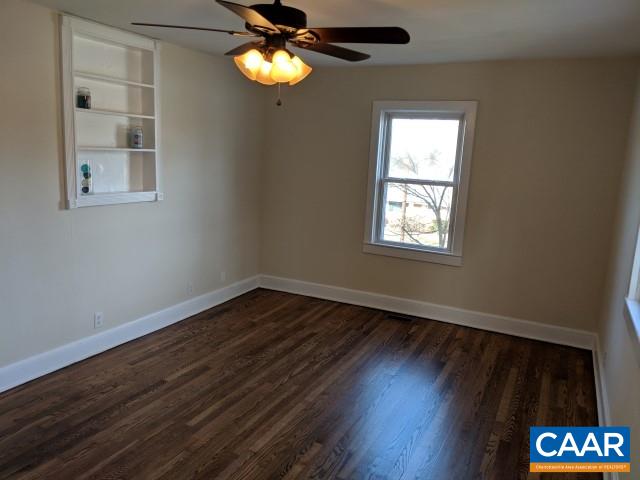 212 Spicers Mill Road Orange, VA 22960 - Photo 4 of 38 a view of an empty room with wooden floor and a window