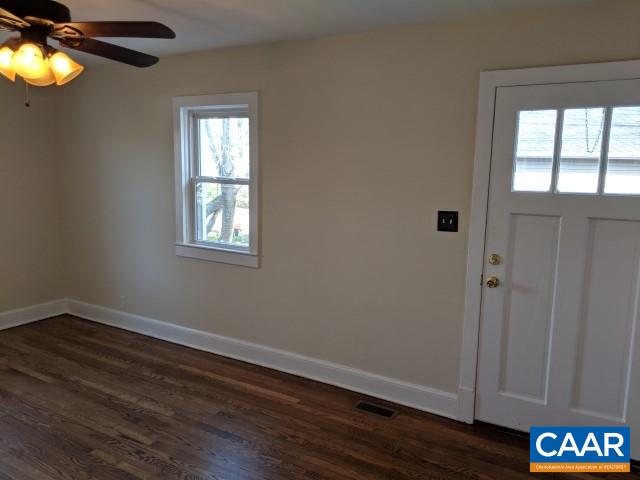212 Spicers Mill Road Orange, VA 22960 - Photo 5 of 38 a view of an empty room with wooden floor and a window
