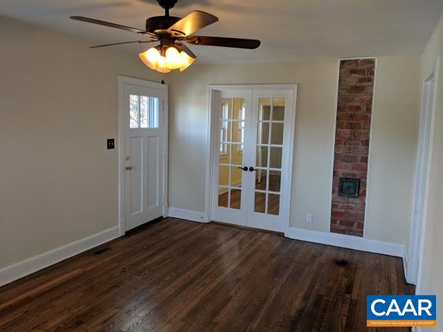 212 Spicers Mill Road Orange, VA 22960 - Photo 6 of 38 a view of an empty room with wooden floor and a window