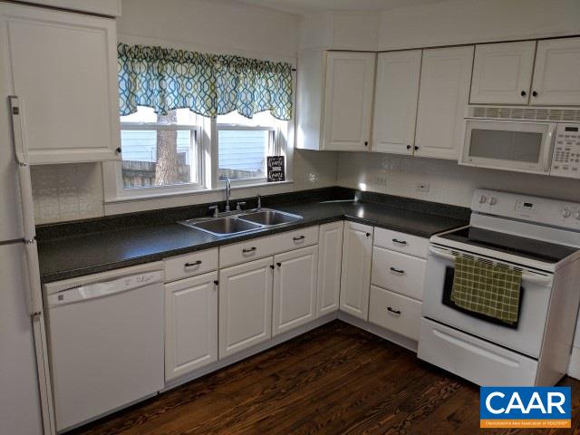 212 Spicers Mill Road Orange, VA 22960 - Photo 8 of 38 a kitchen with granite countertop white cabinets and window