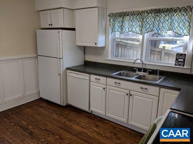 212 Spicers Mill Road Orange, VA 22960 - Photo 9 of 38 a kitchen with a refrigerator and a stove