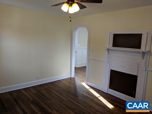 212 Spicers Mill Road Orange, VA 22960 - Photo 10 of 38 a living room with a fireplace and a flat screen tv
