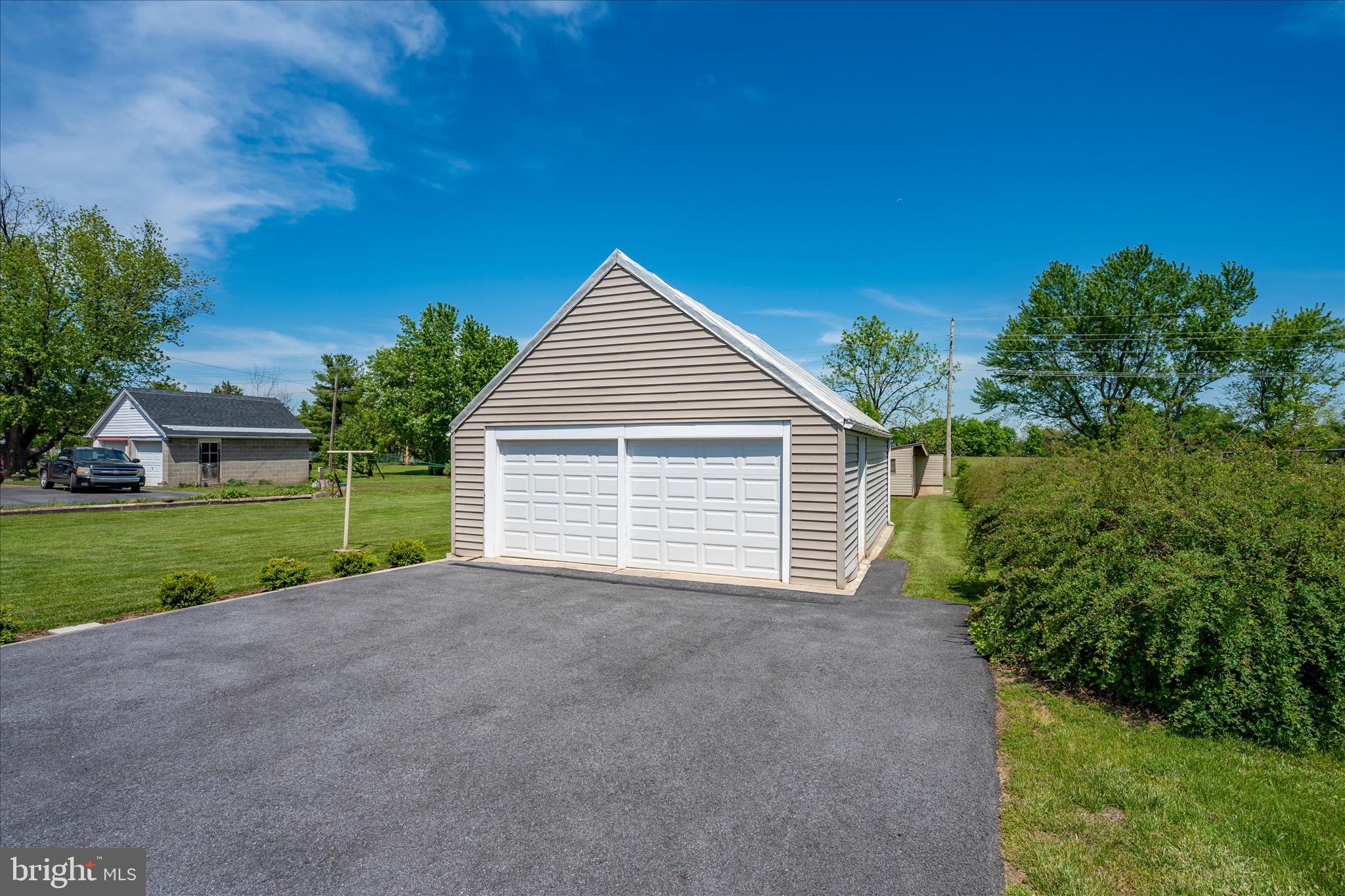 11205 Hessong Bridge Road Thurmont, MD 21788 - Photo 51 of 69 a view of a house with a yard and garage