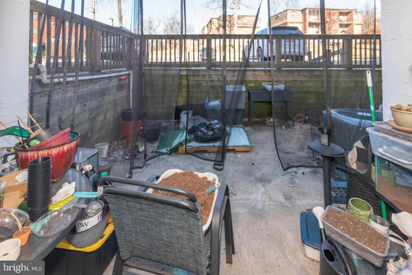 an outdoor living area with furniture and a fireplace