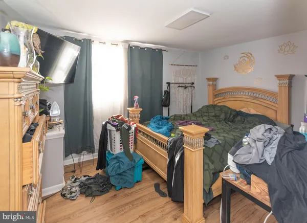 a kitchen with stainless steel appliances kitchen island granite countertop a refrigerator and a stove